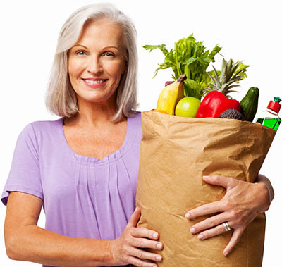 woman's groceries with vegetables